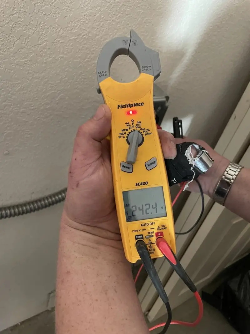 Voltage testing with clamp meter during Ceiling Fan Installation in Kennett